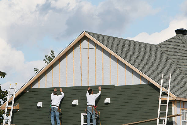 Professional Storm Damage Siding Repair technician working in Smithfield, NC